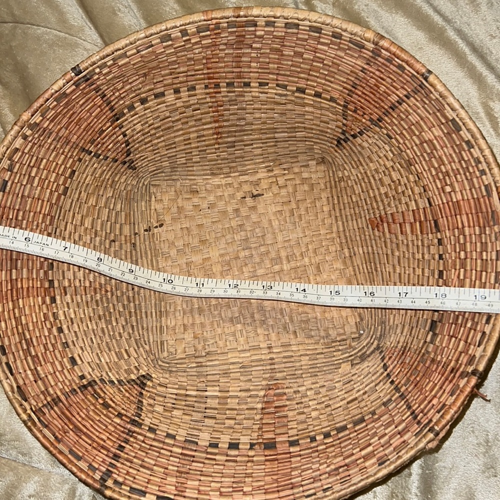 Antique Native American round basket 14” wide by 4” tall. Hand woven